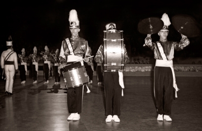 L-R: Vic Kruklis on snare, Ron Kaiser hiding behind the Rudimental Bass and Bill Grigg on cymbals, Toronto Optimists mini-corps (Kitchener, 1963)
Photo by Don Daber
Keywords: 1963
